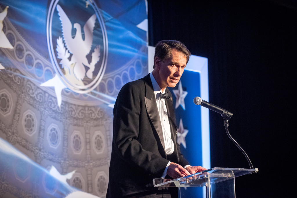 John Lenczowski, Founder and President of the Institute of World Politics (IWP), addresses the audience during the Institute of World Politics (IWP) Silver Anniversary Gala and Chancellor's Dinner at the Ritz Carlton, Pentagon City, Va., October 14, 2015. The IWP is an independently accredited graduate school with five Master's Degree Programs and seventeen Graduate Certificate programs focusing on foreign relations, diplomacy, national strategy, American founding principles, and moral leadership and applied ethics among others. IWP photo by Cherie Cullen